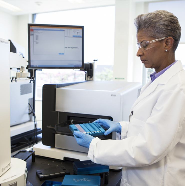 researcher with iScan and flow cells